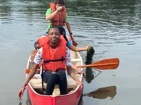 a group of people in a canoe