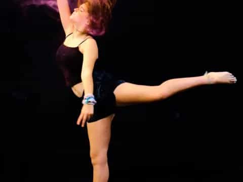 a woman dancing on a stage