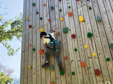 a person climbing a rock wall