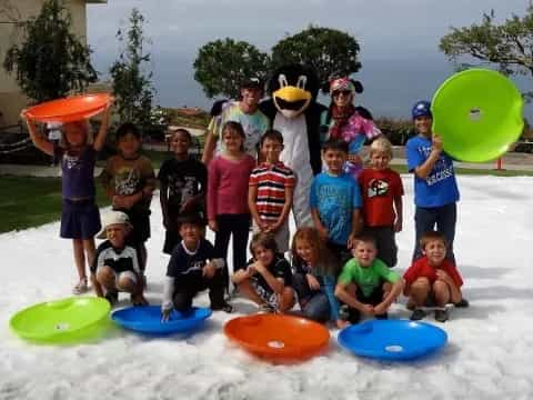 a group of kids posing for a photo