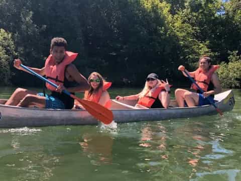 a group of people in a canoe