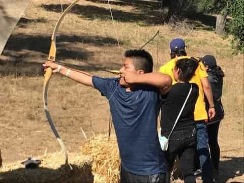 a group of people holding a rope