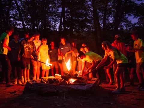 a group of people around a fire
