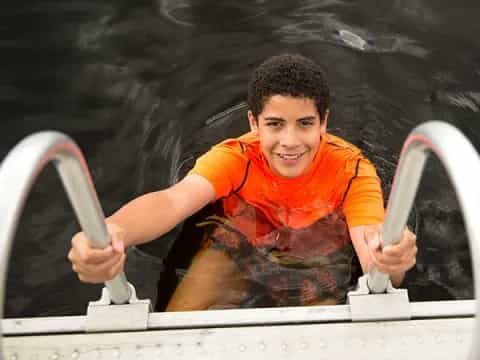 a person holding a steering wheel