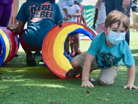 a boy playing with a toy