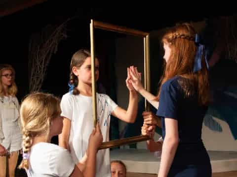 a group of people holding sticks