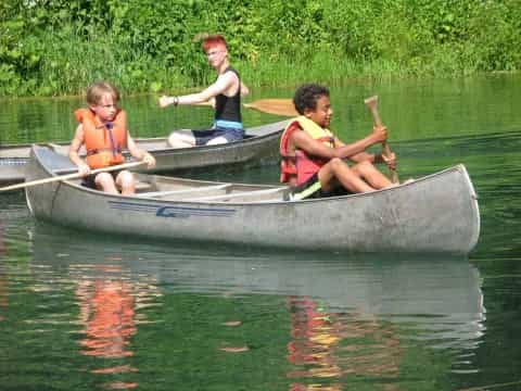 a group of people in a canoe
