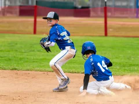 a couple of kids playing baseball