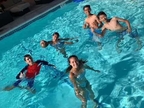 a group of people in a pool