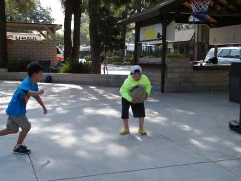 a person and a boy playing with a frisbee