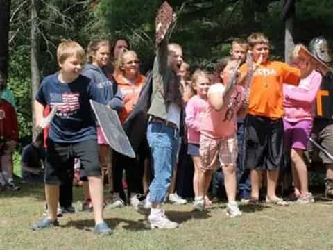 a group of people holding swords