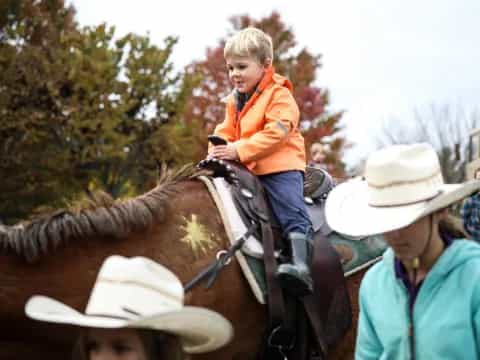 a child riding a horse
