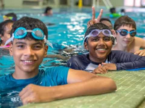 a group of boys in a pool