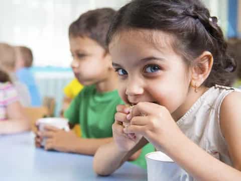 a young girl eating food