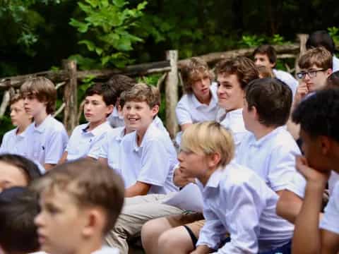 a group of boys in white shirts