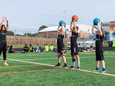 a group of people playing basketball