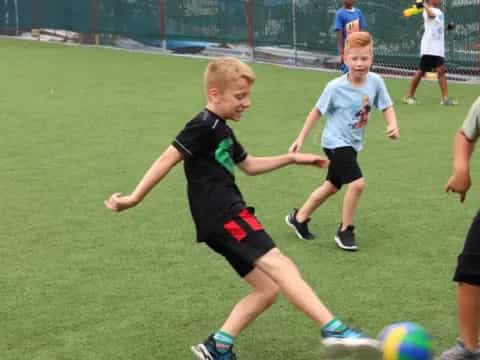 a group of kids playing football