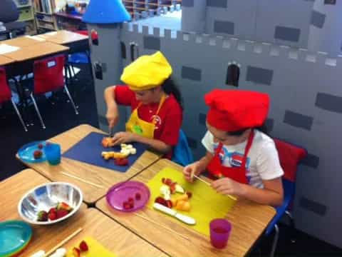 kids wearing yellow hats