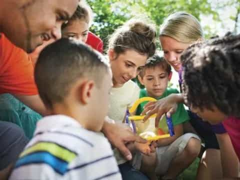 a group of people gathered around a child