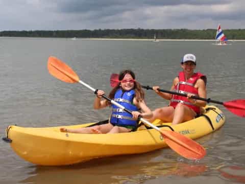 a group of people in a canoe