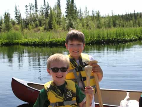 two boys in a canoe