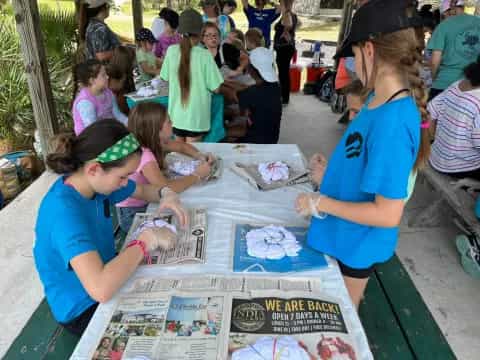 a group of people painting