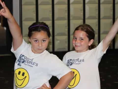 two girls in white shirts