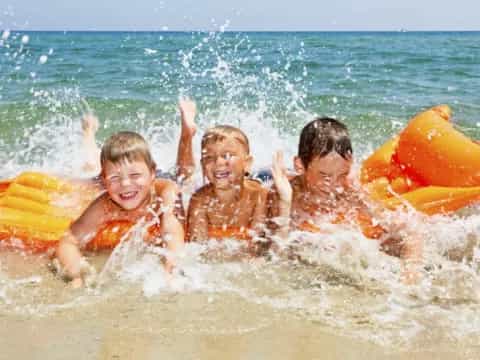 a group of kids in the water