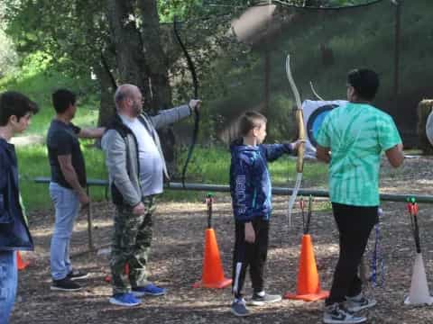 a group of people holding a rope