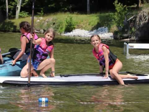 a group of girls in a canoe