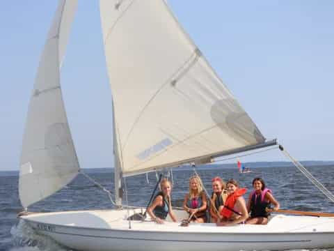 a group of people on a sailboat