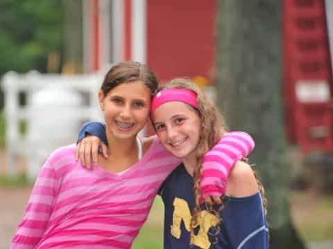 a couple of girls smiling