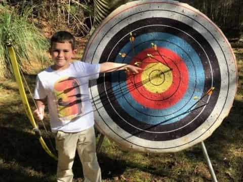a boy holding a target