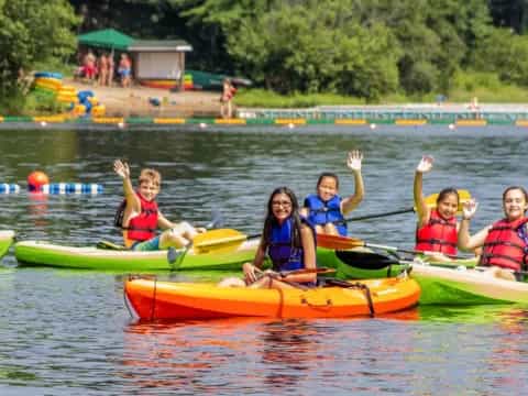 a group of people in canoes