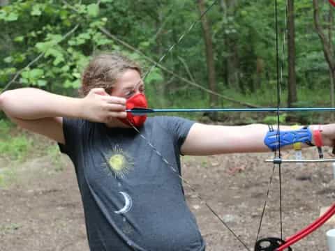 a person holding a bow and arrow