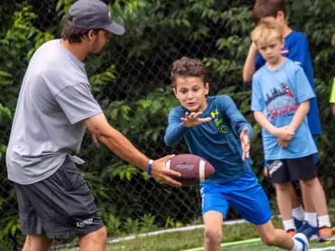 a boy holding a football