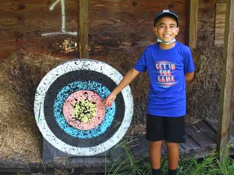 a boy holding a wheel