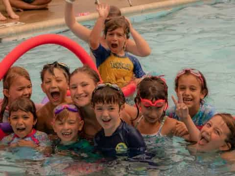 a group of children in a pool