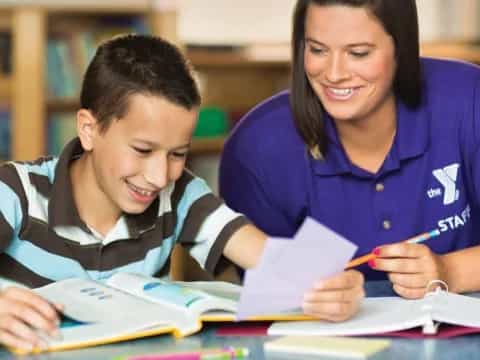 a person and a boy studying