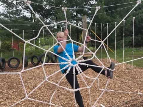 a man and a woman on a swing set