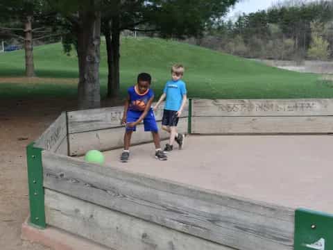 two boys playing with a ball