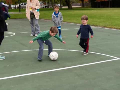kids playing with a football ball