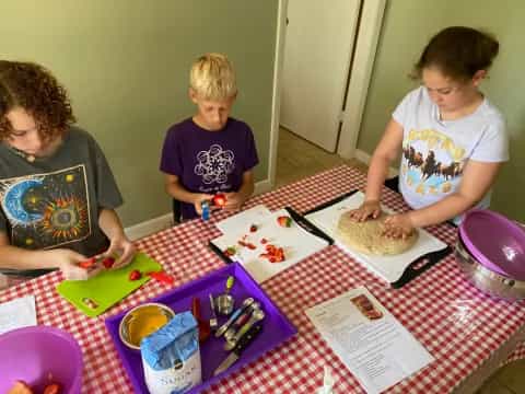 a group of kids painting