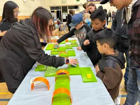 a group of people playing a board game