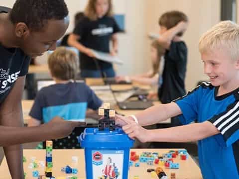 a group of kids playing with toys