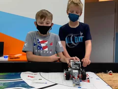 a few boys wearing masks