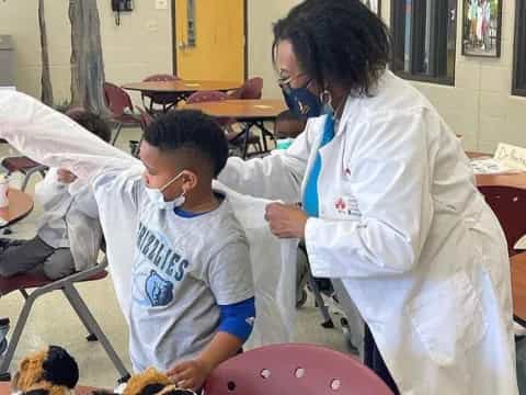 a man and a boy in a hospital bed
