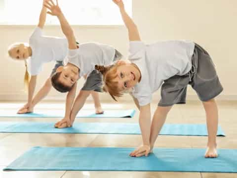 a group of people doing yoga