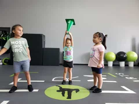 a group of children holding balloons