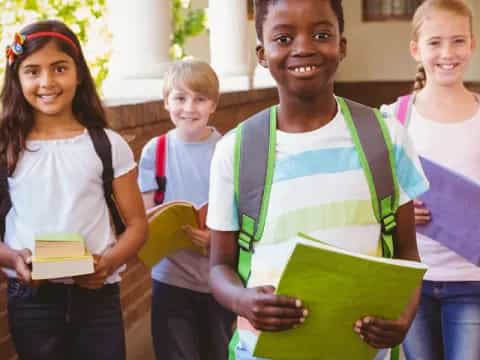 a group of people holding books